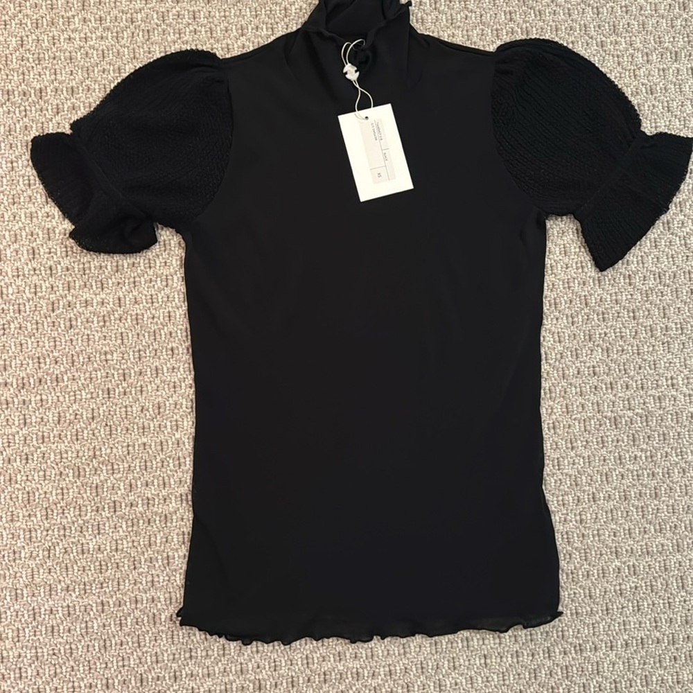 Never worn/w tags CO black stretchy sheet fabric top with puff sleeve. Xsmall.